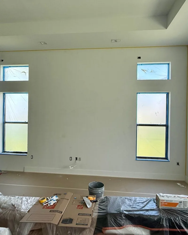 Before: plain primed wall in a new South Florida home